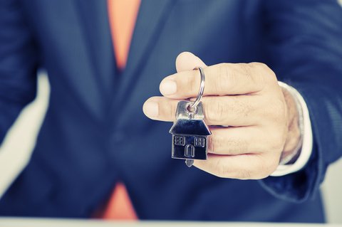 man holding house keys