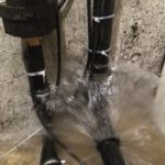 Pipe spewing water in basment