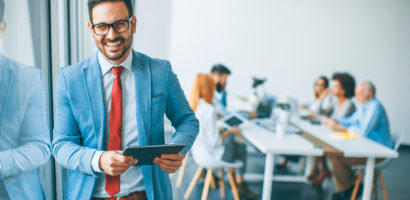 Portrait,Of,Young,Businessman,With,Digital,Tablet,In,Office