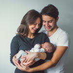 Woman and Man holding A Newborn baby