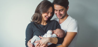 Woman and Man holding A Newborn baby