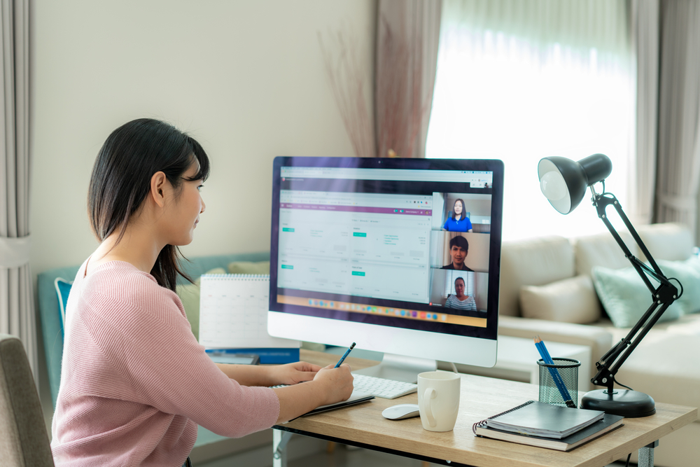 business woman talking to her colleagues about plan in video conference