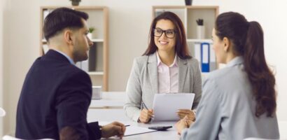 couple meets with insurance broker in office