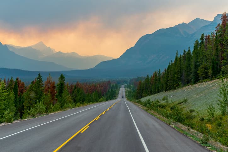 Mountain highway stretching through Jasper National Park during smoky wildfire conditions