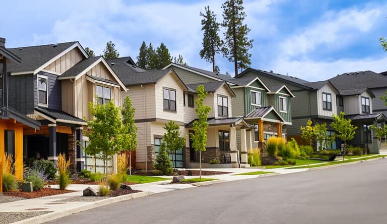 Modern suburban homes lined along a residential street in Edmonton